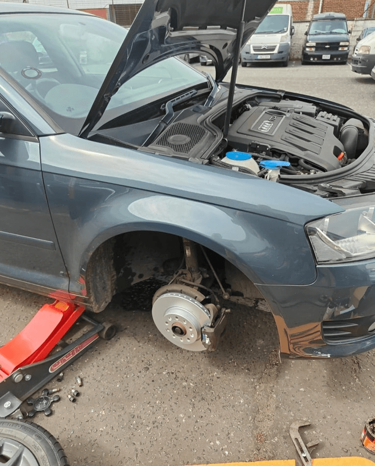Mechanic working on a car